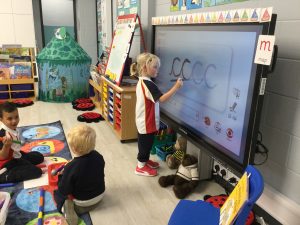 Child using a smart board